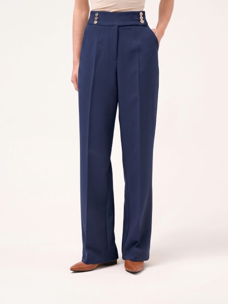 Trousers with buttoned strap